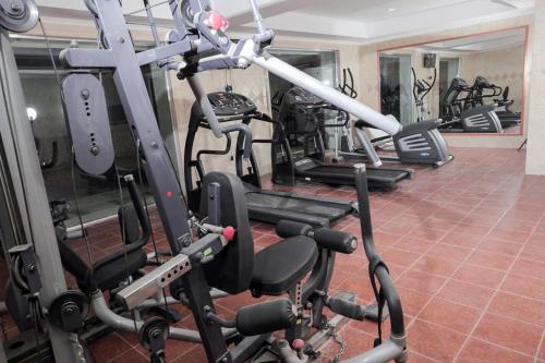 a gym with several tread machines in a row at The Villa 604 Powered by look in Cairo