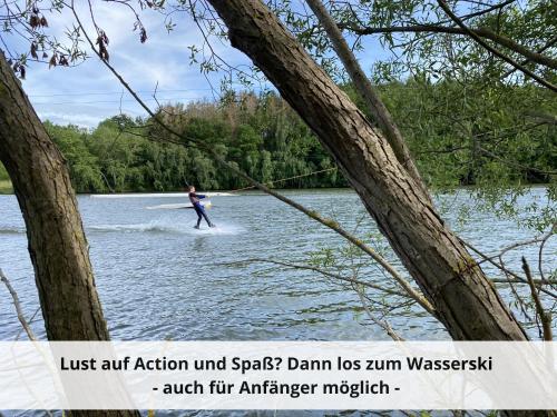 a person is water skiing on a lake at Mein-Seepark, Ferienhaus Heike in Kirchheim
