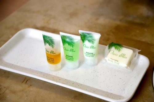 four products on a tray on a table at Waypoint Hotel in Karachi