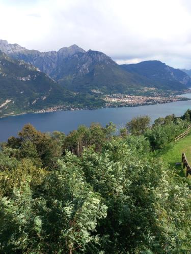 a view of a lake with mountains in the background at La casa di Tina - Civenna in Civenna