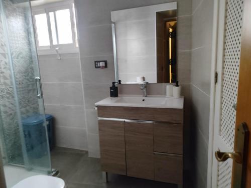 a bathroom with a sink and a toilet and a shower at San Francisco in Tarifa