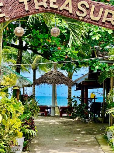 a resort with a sign that reads tree service at Treasure Beach Resort in Carles