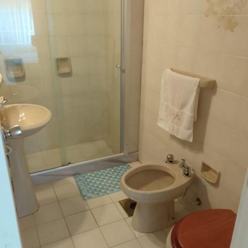 a bathroom with a shower and a toilet and a sink at MAR DEL ESTE III PUNTA DEL ESTE in Punta del Este