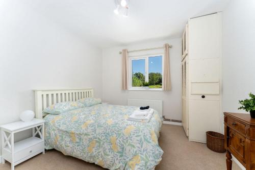 a bedroom with a bed and a window at Cottage 435 - Clifden in Clifden