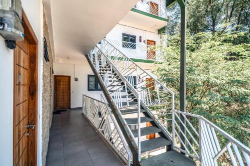 a staircase leading up to a house at Komodo Suites Downtown in Labuan Bajo