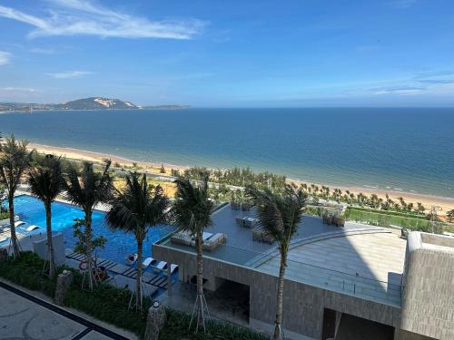 a view of the beach and a resort with a swimming pool at Mandala Muine M2012A in Phan Thiet