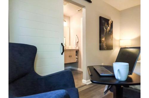 a room with a desk with a laptop and a chair at Charming Studio wDeck Garden in San Antonio
