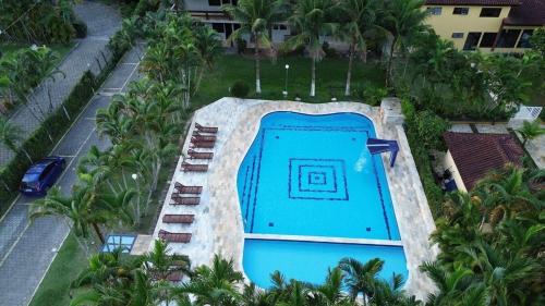 an aerial view of a swimming pool at a resort at TrevizZo Sun House Maresias in São Sebastião
