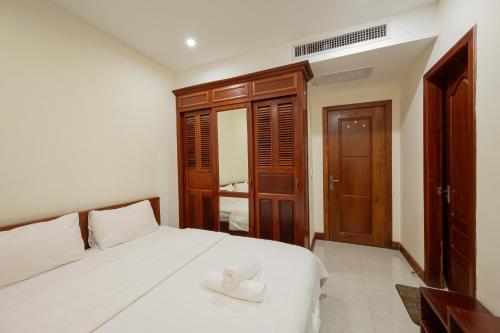 Postel nebo postele na pokoji v ubytování E&V Apartment