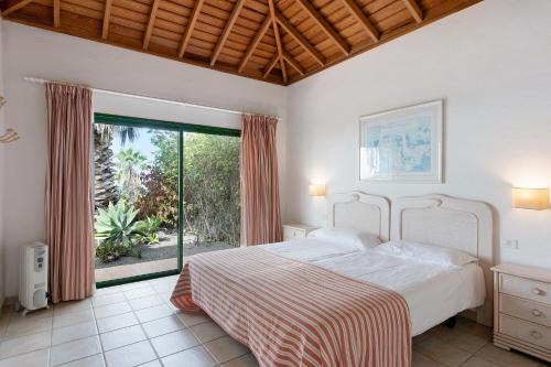 Ένα ή περισσότερα κρεβάτια σε δωμάτιο στο La Villa La Palma- 1 dormitorio B