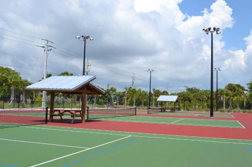 two tennis courts on a tennis court at Enjoy the Siesta Key Beach Life to the fullest! Beach AND Pool Access in Siesta Key