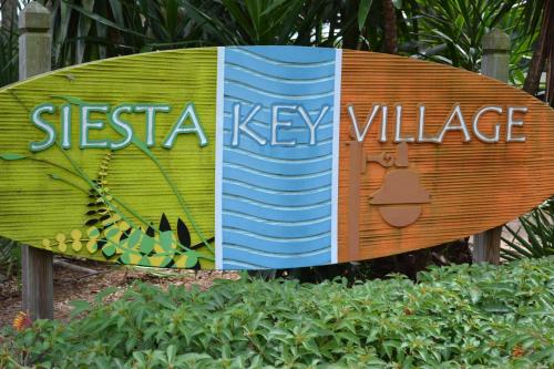 a sign that says siesta key village at Enjoy the Siesta Key Beach Life to the fullest! Beach AND Pool Access in Siesta Key