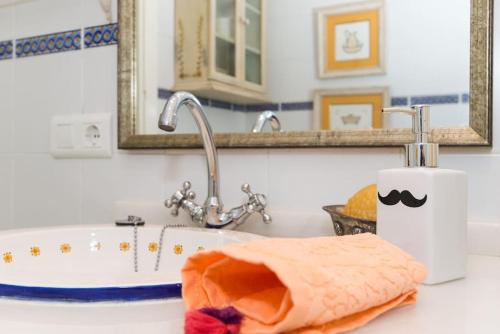 a bathroom counter with a sink and a bath tub at Apt. Sierpes-Cuna, wifi, HVAC (VFT/SE/00239) in Seville