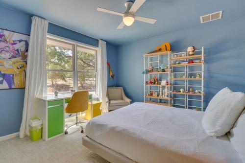 a bedroom with a bed and a desk and a window at Modern Austin Home with Yard about 1 Mi from ACL! in Austin