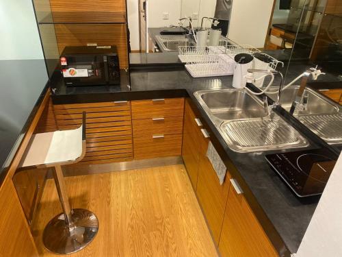 a kitchen with a sink and a counter at KL Dua Sentral Dreamy Stay Studio in Kuala Lumpur