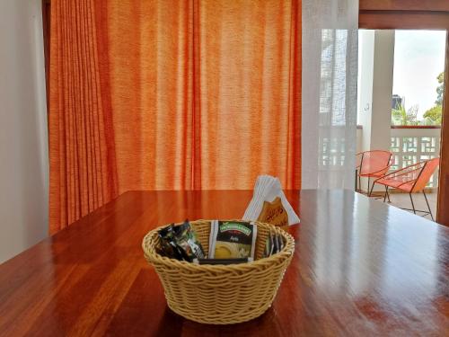 a basket sitting on top of a wooden table at Morona Flats & Pool - 70 m2 in Iquitos