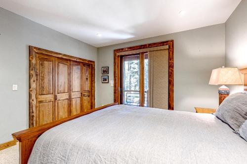a bedroom with a large bed and a window at Log Luxury in Tahoe Vista