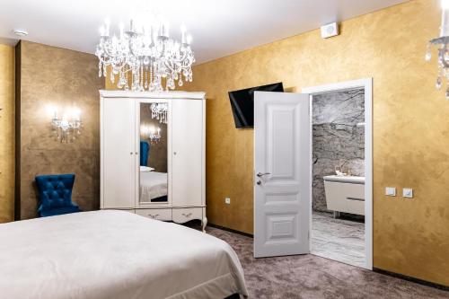 Postel nebo postele na pokoji v ubytování Zhytomyr palace mimino