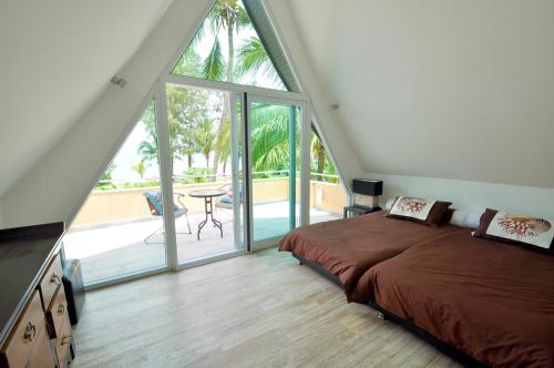 Postel nebo postele na pokoji v ubytování White Dragon Sea View Villa