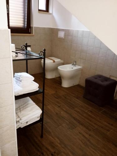 a bathroom with a toilet and a sink at Peppinella Affittacamere in Cetraro