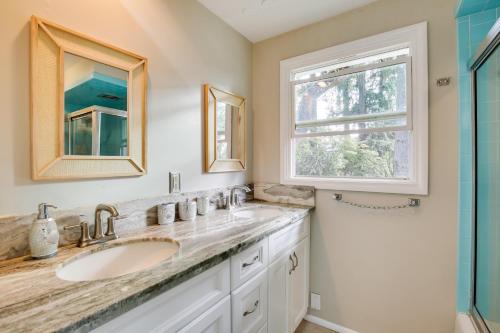 a bathroom with two sinks and a window at Eugene Vacation Home 2 Mi to University of Oregon in Eugene