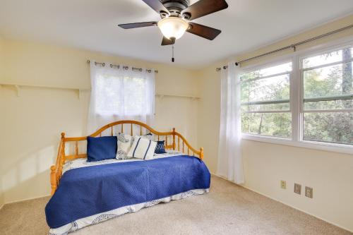 a bedroom with a bed and a ceiling fan at Eugene Vacation Home 2 Mi to University of Oregon in Eugene