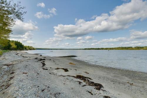 a beach with a body of water and clouds at Beachfront Brooklin Studio with Private Balcony! in Brooklin