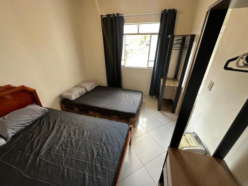 Katil atau katil-katil dalam bilik di Casa aconchegante
