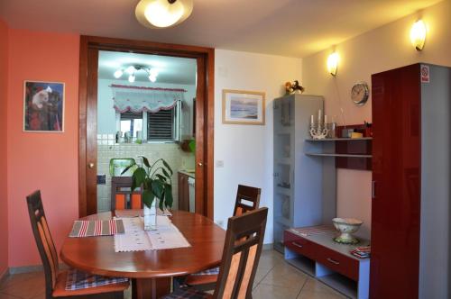 a dining room with a wooden table and chairs at Uvala Apartment in Dubrovnik