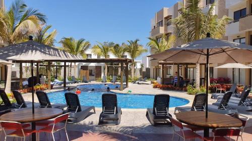 Bazén v ubytování Bonito Departamento cerca de las Playas del Puerto de Mazatlán. nebo v jeho okolí