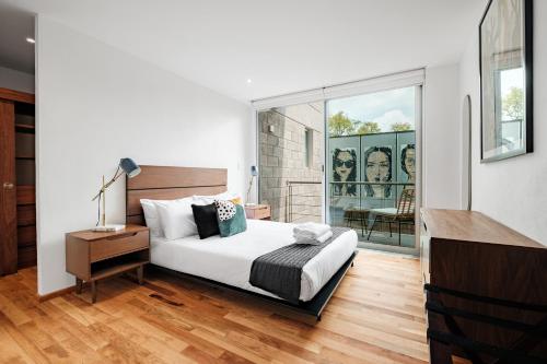 Ένα ή περισσότερα κρεβάτια σε δωμάτιο στο New Apartments La Condesa by VIATO