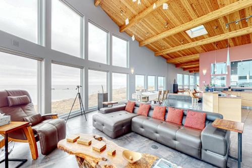 a living room with a couch and a table at Pacific Bliss Haven in Gualala