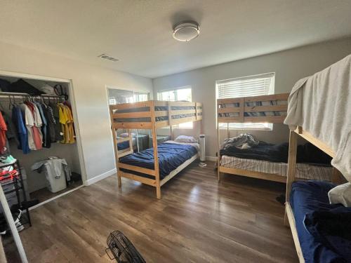 a room with two bunk beds and a closet at We are in this together in Santa Ana