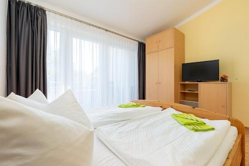 Postel nebo postele na pokoji v ubytování Appartement 4 - Ostseeblick