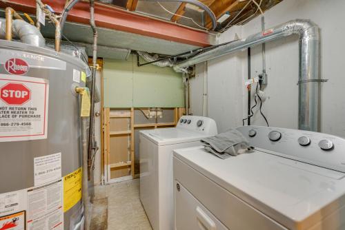 a laundry room with two washes and a washer at Pet-Friendly Dearborn Home Less Than 2 Mi to Downtown! in Dearborn