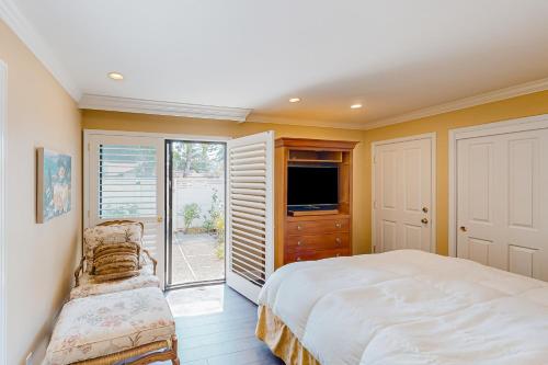 a bedroom with a bed and a tv and a window at Silverado Resort and Spa 381 & 382 in Napa