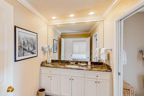 a bathroom with a sink and a mirror at Silverado Resort and Spa 381 & 382 in Napa