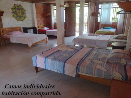 Una cama o camas en una habitación de Hostal Ariantiy
