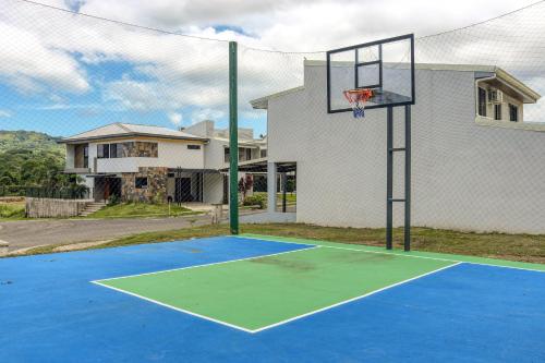 a basketball hoop in front of a house at Casa Eureka in Herradura
