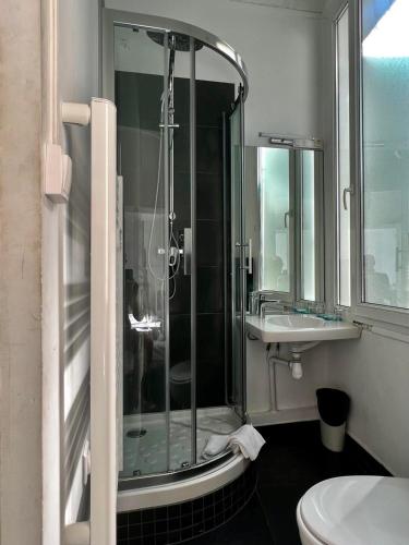 a bathroom with a shower and a toilet and a sink at Chanteclair in Cannes