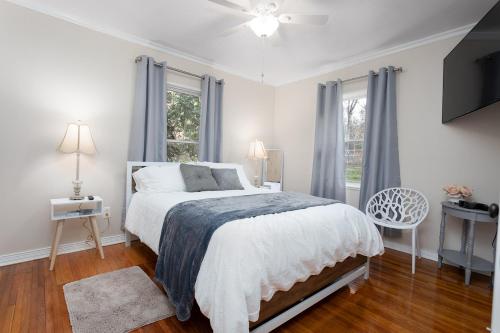 a white bedroom with a bed and a window at The Chattanooga Chill-Out in Ooltewah