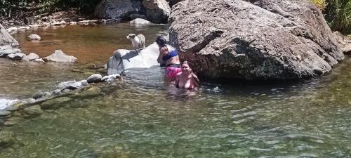 two women in the water in a river at Casa campó in Cali