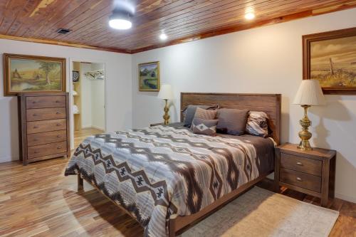 a bedroom with a large bed and a wooden ceiling at Spacious McMinnville Vacation Home with Gas Grill! in McMinnville