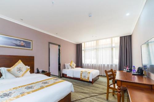 Una cama o camas en una habitación de Seattle Hotel