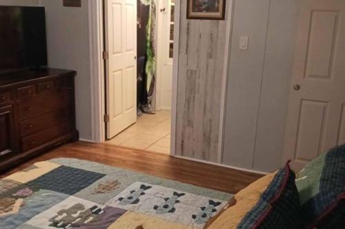 a living room with a couch and a rug on the floor at Barfoot Bay Beautiful 3/2 in Sebastian
