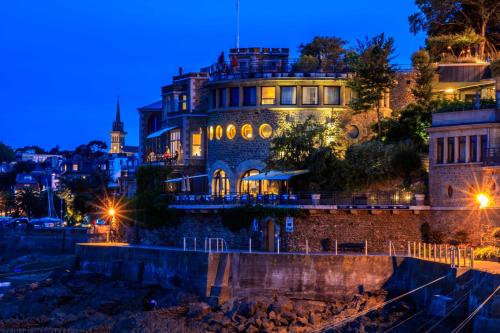 an old building in a city at night at LE PRIEURE in Dinard