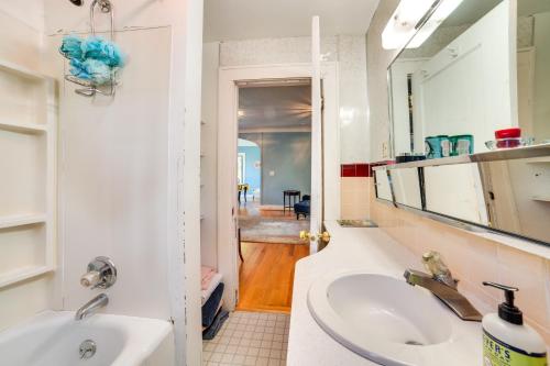 a bathroom with a sink and a mirror at Historic Seattle Vacation Rental in Seward Park! in Seattle