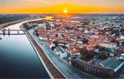an aerial view of a city with a bridge and water at Loft 27 in Kaunas