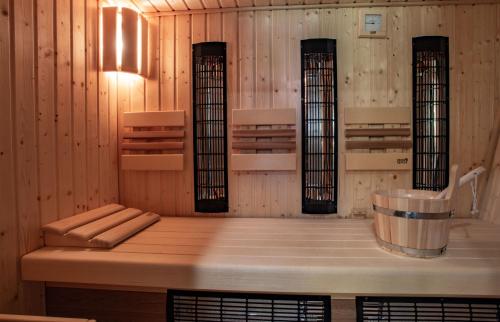 a room with wooden walls and a bench in a room at Chalet Belveder Železná Ruda in Železná Ruda