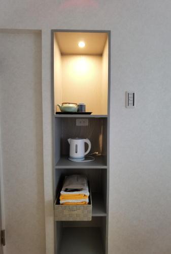 a closet with a shelf with a tea kettle on it at belle via tokyo - Vacation STAY 60795v in Tokyo